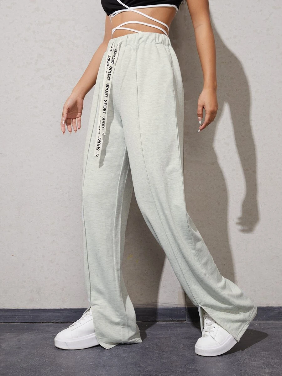 Quần thể thao nữ Dây kéo Túi Chia Lá thư - Màu Xám nhạt - Xem 1