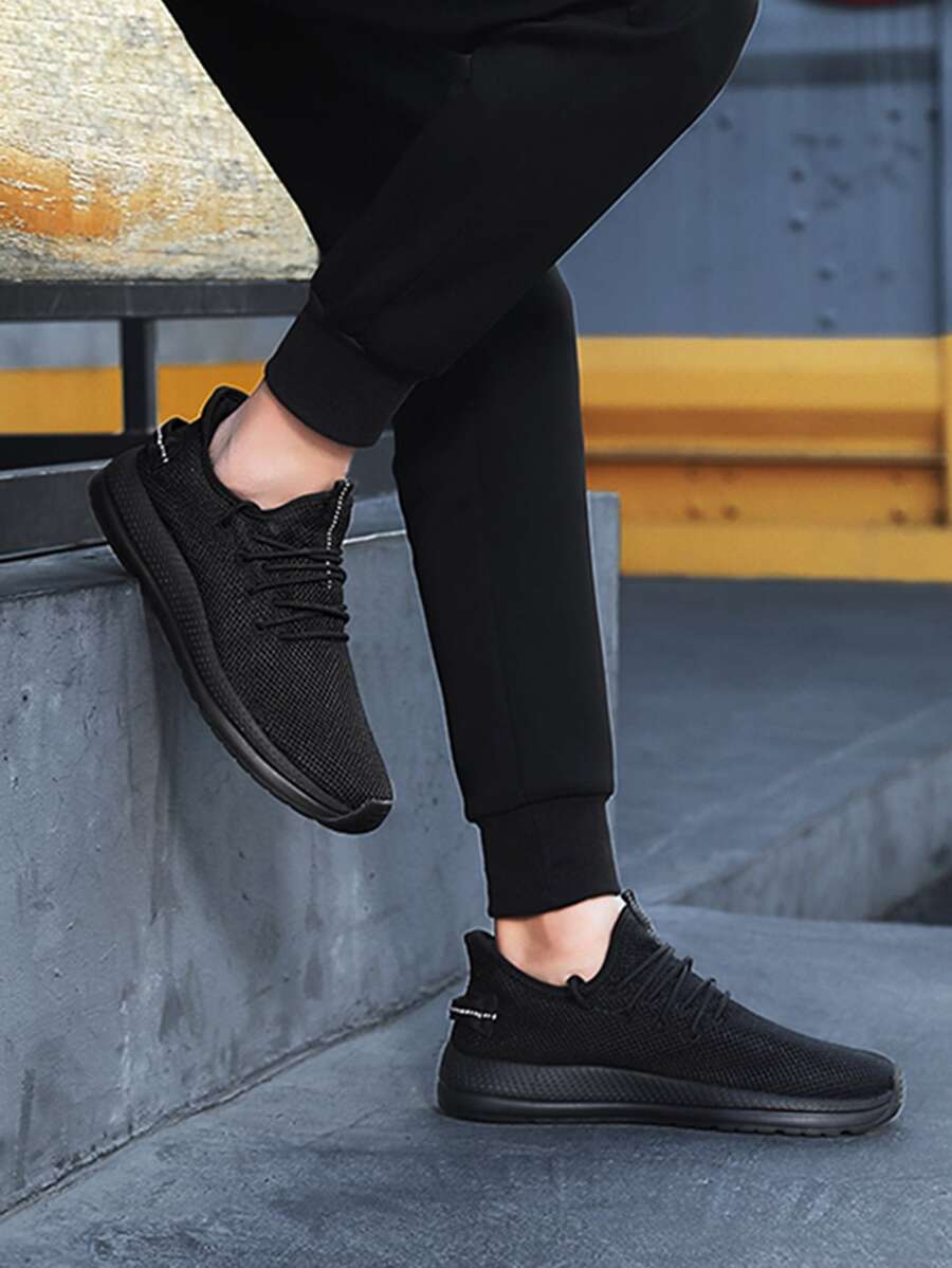 Hombres Zapatos de atletismo tejido de canalé - Negro - Ver 1