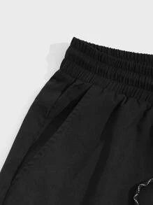 Manfinity NiteLyfe Shorts holgados para hombre con bolsillos en diagonal y cordón en la cintura - Negro - Ver 3
