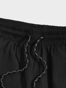 Manfinity NiteLyfe Shorts holgados para hombre con bolsillos en diagonal y cordón en la cintura - Negro - Ver 4