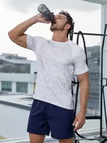 SHEIN Fitness Hombres Camiseta deportiva con estampado de dibujo de manga raglán - Blanco - Ver 1