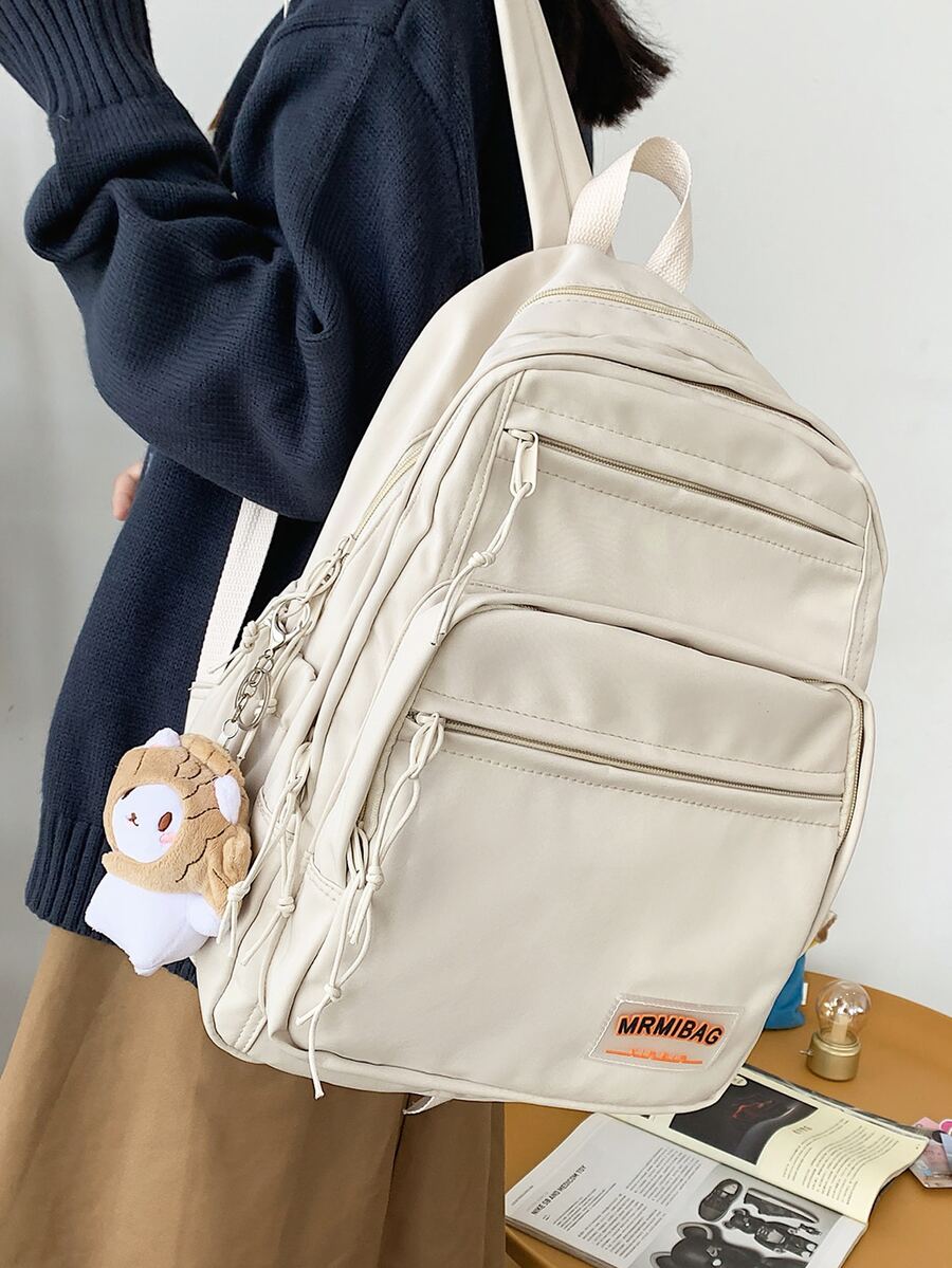 Mochila con diseño de parche de letra con accesorio de bolso