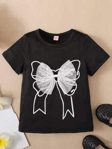 SHEIN Camiseta de manga corta de cuello redondo para niñas jóvenes con acabado en borde negro, con impresión frontal y decoración de malla blanca con lazos, para verano