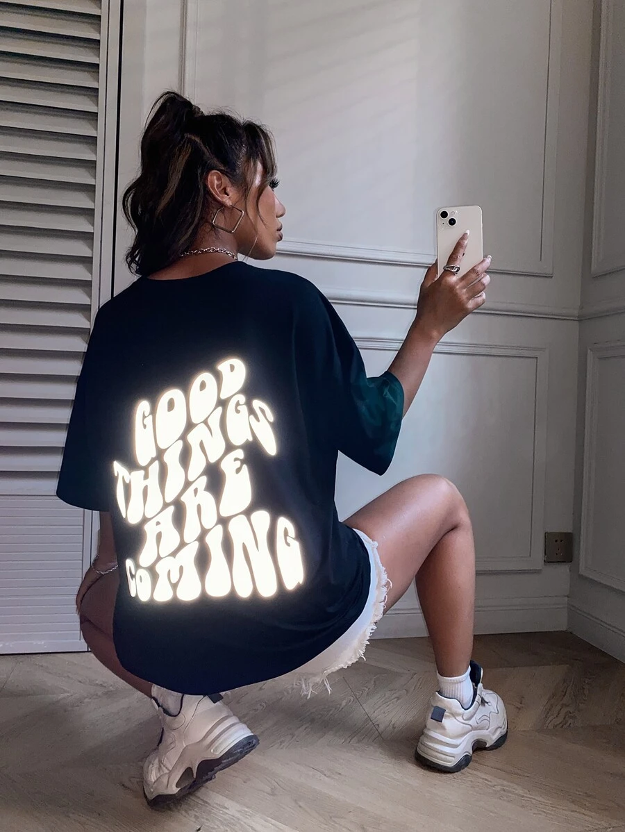 SHEIN Unity Reflective Slogan Graphic Drop Shoulder Tee GOOD THINGS ARE COMING Graphic Tees Women Tops - Black - View 1