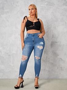 SHEIN Essnce Jeans ajustados desgarro de talle alto