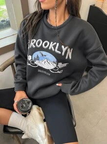 Áo nỉ Đồ họa đại bàng và chữ cái Thả vai - Màu xám đen - Xem 1