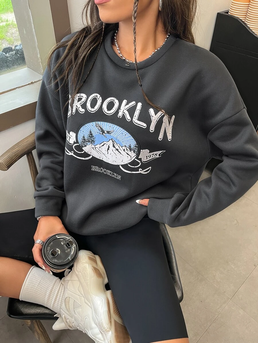 Áo nỉ Đồ họa đại bàng và chữ cái Thả vai - Màu xám đen - Xem 1