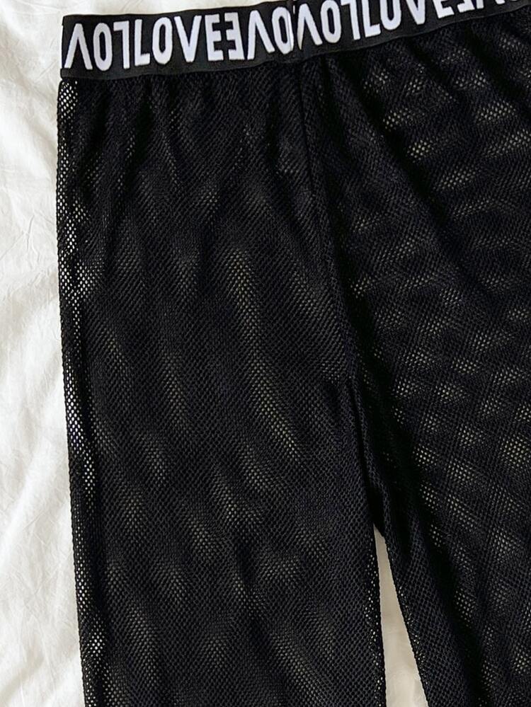 Cover up con abertura en contraste con cinta con letra - Negro - Añade 4