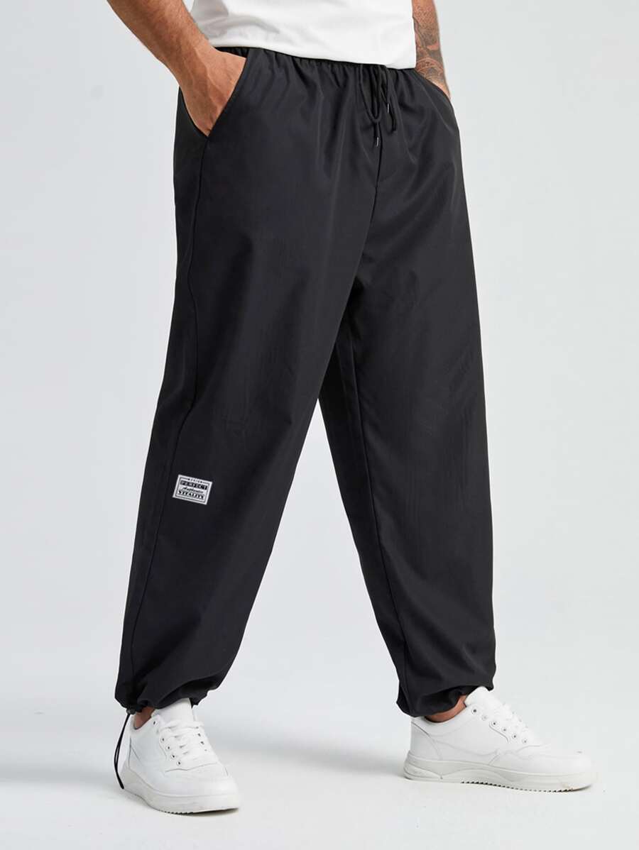 Manfinity Homme Men Letter Patched Detail Drawstring Waist Tapered Trousers - Black - View 1
