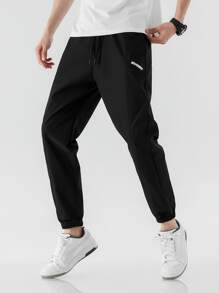 Manfinity Hombres Pantalones con estampado de letra de cintura con cordón - Negro - Ver 1