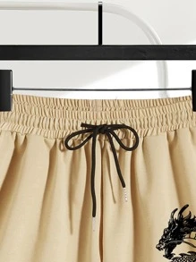 Manfinity Roghcode 鬆身男款龍紋和字母印花束口短褲