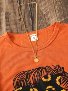 SHEIN Camiseta de cuello redondo linda y cómoda simple de estilo urbano para niña preadolescente con estampado de cara de dibujos animados - Naranja - Ver 3