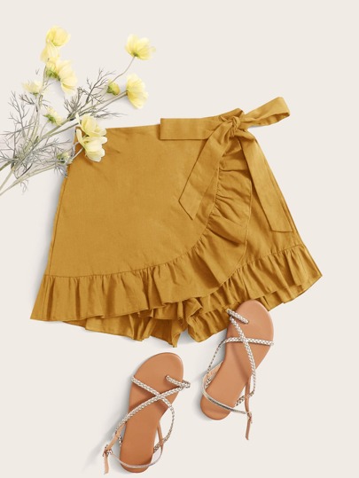 تنورة بلون موحد مقلم بكشكش مقاس كبير وبربطة جانبي