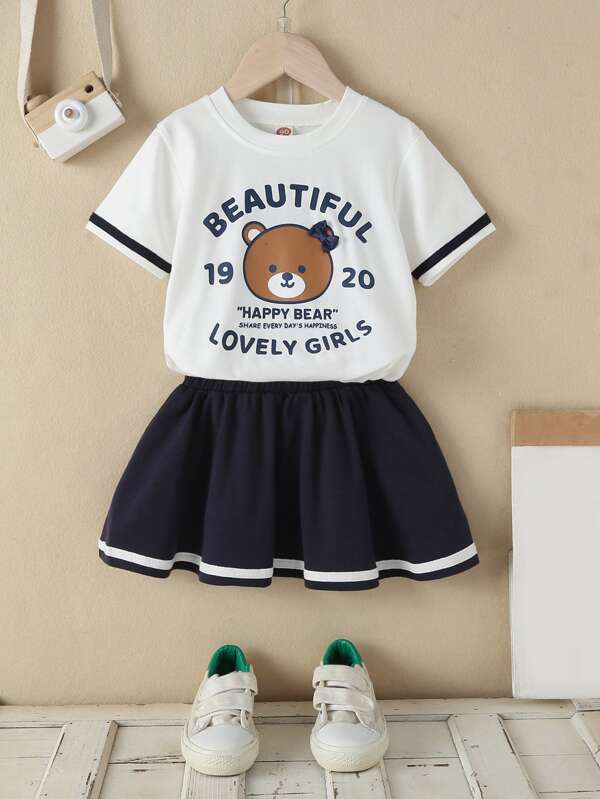 SHEIN Camiseta Y Falda De Dibujo Animado Y Gráfico De Letras Para Niñas Jóvenes