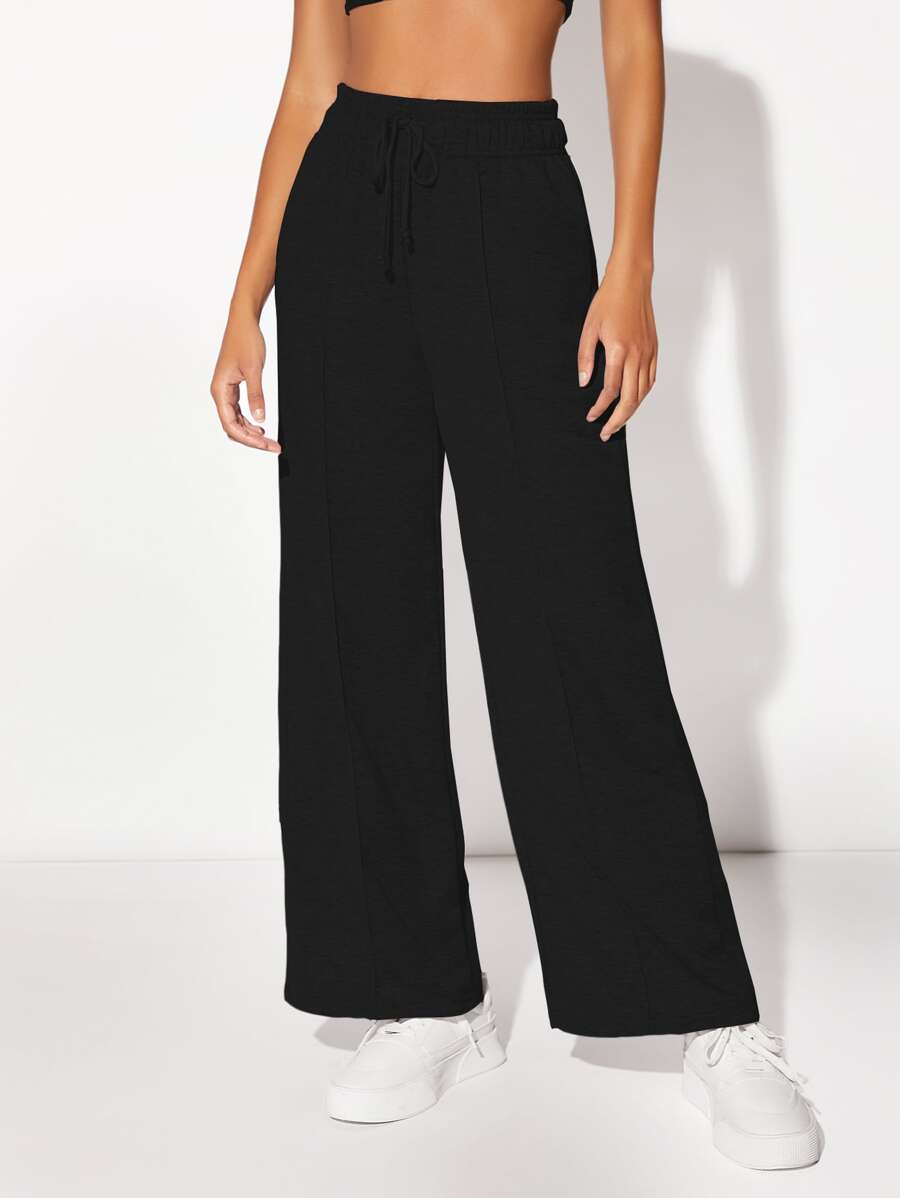 Muchica Quần thể thao nữ Dây kéo Túi màu trơn