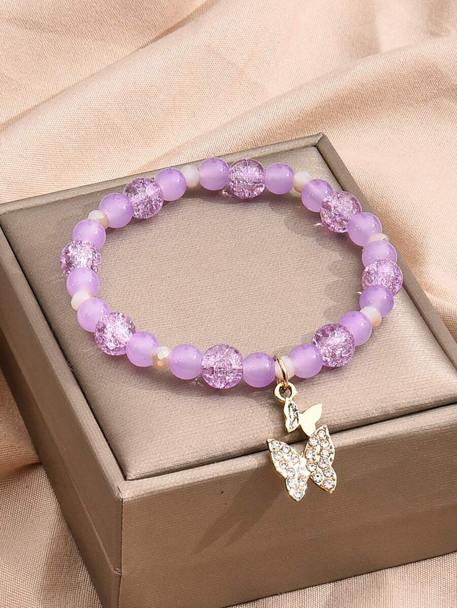 Bracelet perlé à strass à breloque papillon
