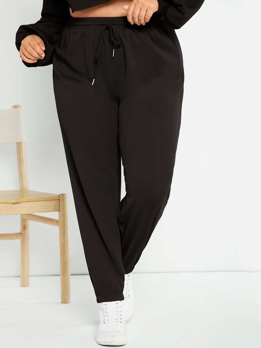 SHEIN Essnce Plus Size Quần thể thao Dây kéo màu trơn - màu đen - Xem 1