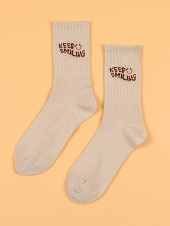 表情和標語圖案中筒襪