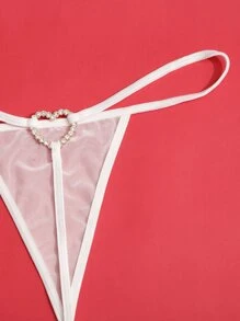 Lencería tanga con malla enlazada y anillo con corazón de strass
