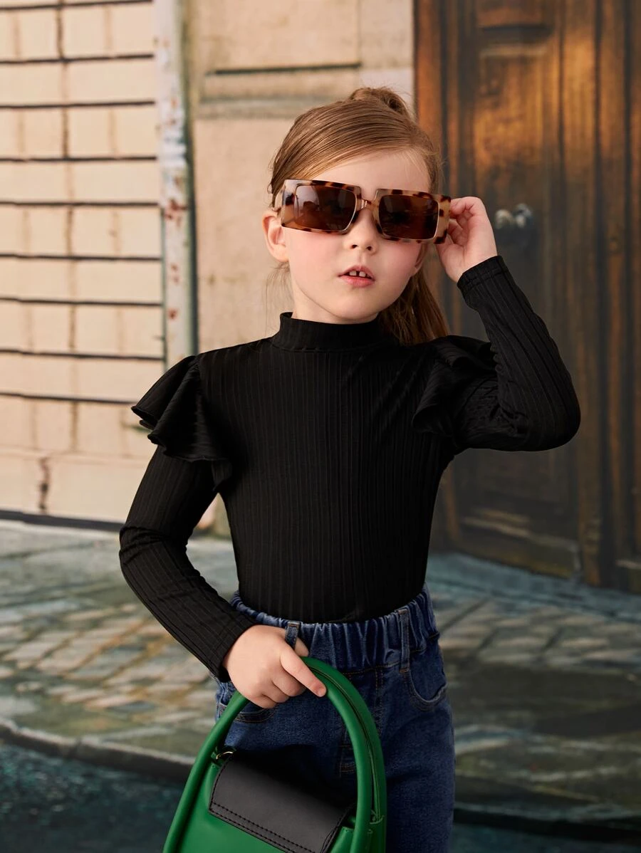 SHEIN Jersey de manga larga con cuello de cisne medio, dobladillo con volantes y color liso suave y versátil para niña - Negro - Ver 1