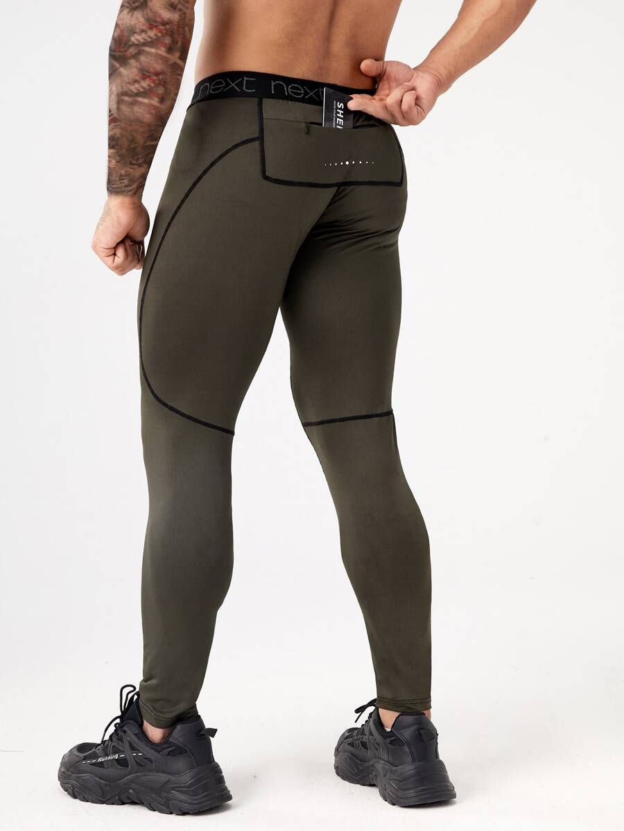 Manfinity Sport Corelite 男士拼接字母織帶頂針運動緊身褲和手機口袋