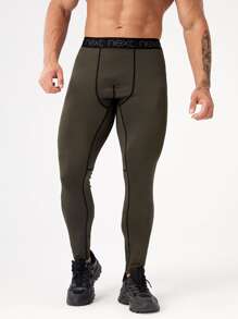 Manfinity Sport Corelite 男士拼接字母織帶頂針運動緊身褲和手機口袋