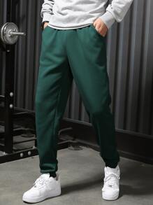 Manfinity Hypemode Men Solid Slant Pocket Joggers - Dark Green - View 1