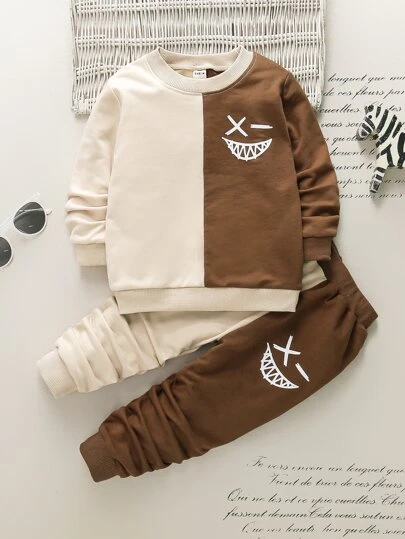 SHEIN Young Boy Cartoon Face Print Two Tone Sweatshirt & Sweatpants