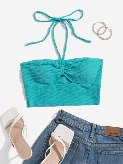 Top corto a fascia verde con taglio frontale e coulisse, adatto per le uscite