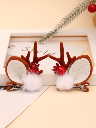 1 par de pinzas para el cabello navideñas con forma de cuernos de reno