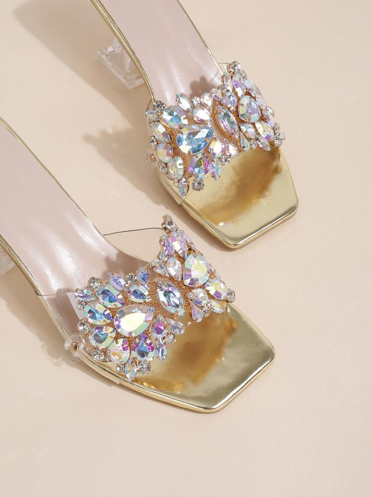 Giày sandal đế bệt cao gót trong suốt đính đá quý, kiểu dáng điêu khắc, thích hợp cho mùa xuân/hè. Sandal cao gót màu vàng kim dành cho nữ với chi tiết đá quý và gót giày độc đáo. - Vàng - Xem 4