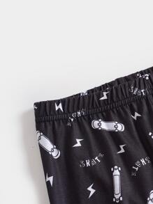 2pcs Boys Snug Fit Pajama Set With Glow-In-The-Dark Football & Skull Design, Long Sleeve Top And Pants, Comfy Holiday Sleepwear - Black - View 5