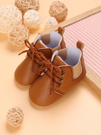 嬰兒荔枝紋壓花前綁帶運動鞋