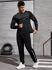 Manfinity Fitness Camiseta deportiva de manga larga con mangas raglán y cinta reflectante, estilo de novio - Negro - Ver 4