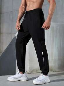 Manfinity Fitness Hombres Pantalones deportivos con estampado de letra de cintura con cordón - Negro - Ver 1