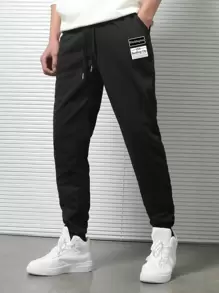 Manfinity Hypemode Hombres Pantalones deportivos con estampado de letra de cintura con cordón - Negro - Ver 1