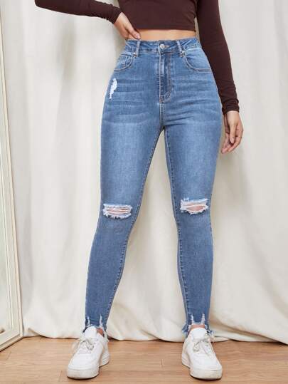 SHEIN Essnce Jeans ajustados con cremallera desgarro bajo crudo
