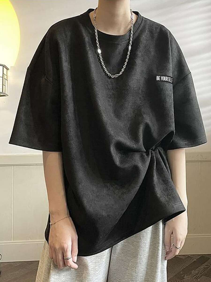 Manfinity Hypemode Camiseta holgada de hombre con parche con eslogan y hombros caídos - Negro - Ver 1