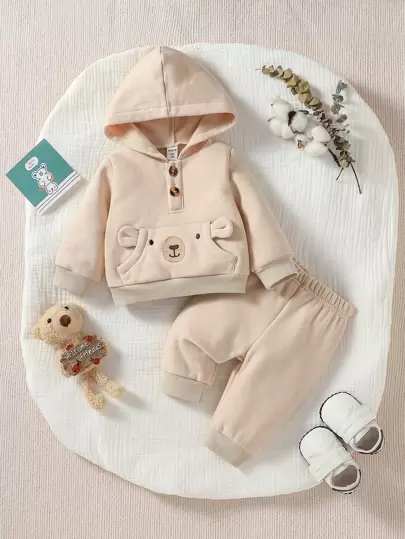 SHEIN Niño recién nacido Pantalones deportivos con capucha con patrón de dibujos animados con bolsillo de canguro