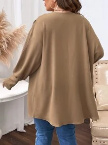 Manteau manches bouffantes ouvert