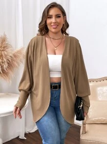 Manteau manches bouffantes ouvert