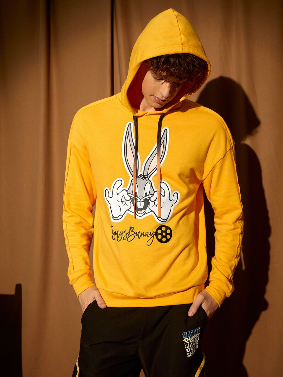 LOONEY TUNES X SHEIN Men Letter and Cartoon Graphic Drawstring Hoodie - Mustard Yellow - View 1
