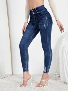 SHEIN Essnce Jeans ajustados rotos con diseño de botón