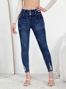 SHEIN Essnce Jeans ajustados rotos con diseño de botón