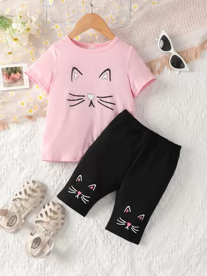 Ung flicka Rosa 2st outfit: Katttryck kortärmad t-shirt med bunden halsringning & ärmslut och svarta shorts med tryckt fåll, sommaravslappnad