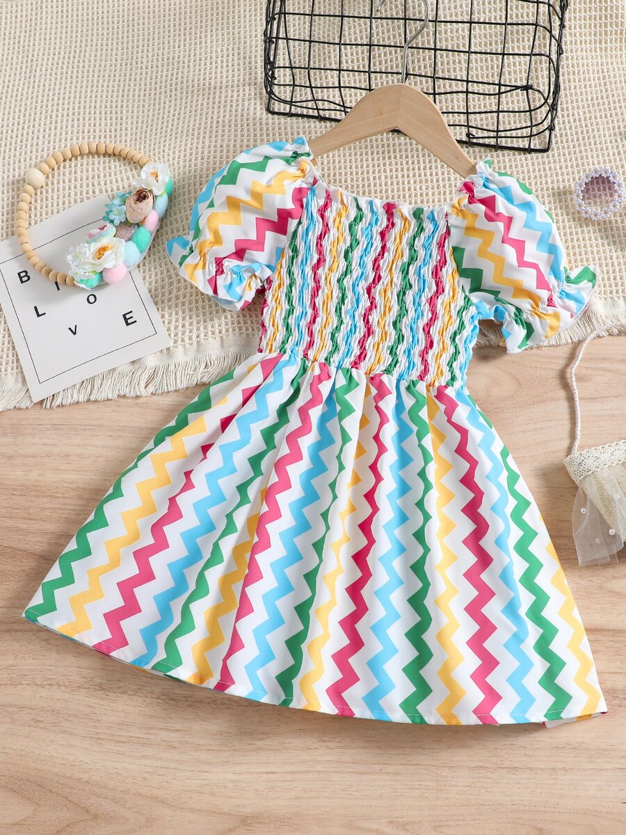 Đầm bé gái Xù Dải chun In chữ V Dễ thương - Nhiều màu - Xem 1