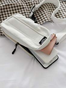 Bolso bandolera mini con parche de letra