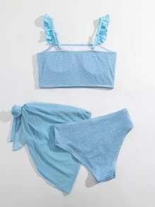 青少年女孩荷叶边褶饰比基尼套装，配有沙滩裙，夏季海滩