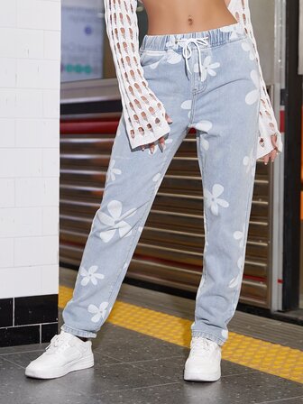 90-tals jeans med dragsko i midjan med blommönster