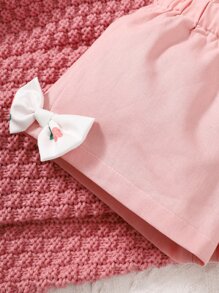 女嬰花卉圖案荷葉邊下擺背心上衣和蝴蝶結短褲和髮箍